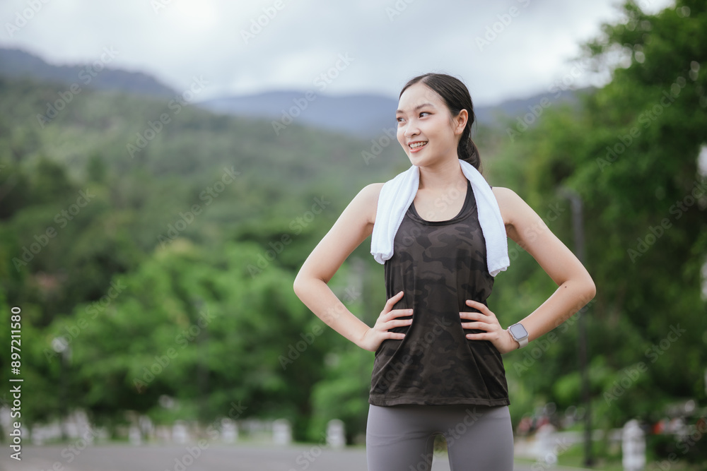 A young woman jogs in the city on a summer morning, embodying an active lifestyle. This fit athlete, dressed in sports clothing, enjoys outdoor exercise, promoting health, vitality, and a healthy life A young woman jogs in the city on a summer morning, embodying an active lifestyle. This fit athlete, dressed in sports clothing, enjoys outdoor exercise, promoting health, vitality, and a healthy life
