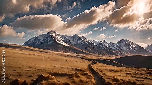 Golden Hour Serenity: A Panoramic View of Majestic Peaks Basking in the Warm Embrace of the Setting Sun