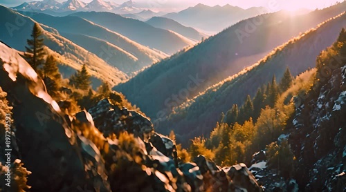 Golden Hour Serenity: A Panoramic View of Majestic Peaks Basking in the Warm Embrace of the Setting Sun