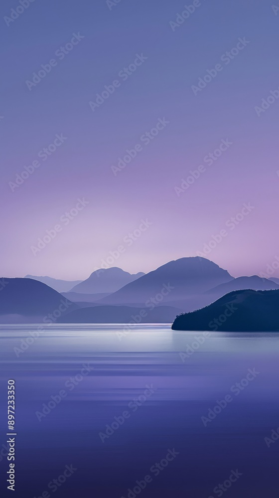 Fototapeta premium A calm lake with mountains reflected in the water