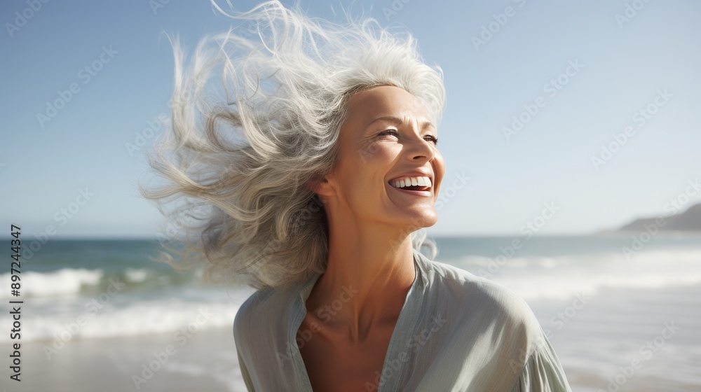 Middle aged woman happily embracing beach life, enjoying the sunny weather and natural lifestyle Middle aged woman happily embracing beach life, enjoying the sunny weather and natural lifestyle