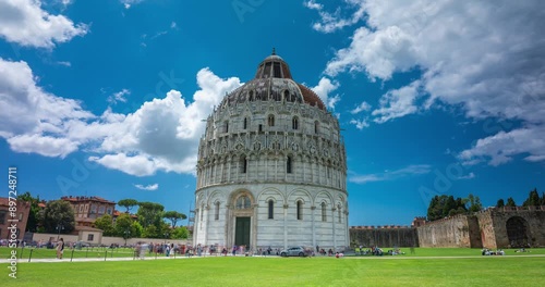 Pisa, Italy - June 02, 2024: View to Battistero di San Giovanni church. Time-lapse, zoom-in transition. photo