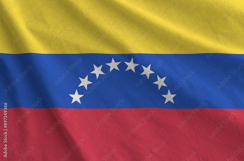 Venezuela flag depicted on folded wavy fabric of old cloth close up Venezuela flag depicted on folded wavy fabric of old cloth close up