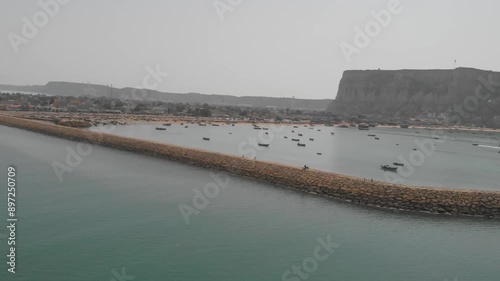 Gwadar is a port city on the southwestern coast of the Pakistani province of Balochistan. The city is located on the shores of the Arabian Sea, opposite Oman and has a population of over 90,000. photo