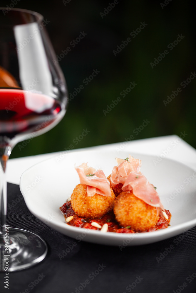 Arancini, com tomatada, presunto cru e pinoli.
Arancini, with tomato, raw ham and pine nuts. Arancini, com tomatada, presunto cru e pinoli.
Arancini, with tomato, raw ham and pine nuts.