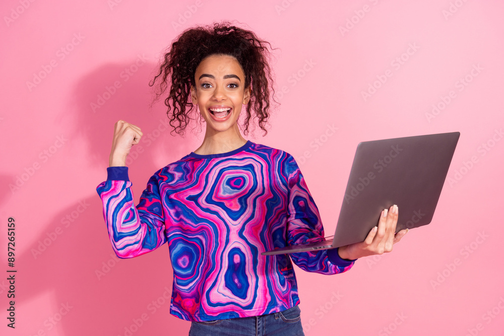 Photo of lucky pretty lady dressed retro sweatshirt winning game modern device isolated pink color background Photo of lucky pretty lady dressed retro sweatshirt winning game modern device isolated pink color background