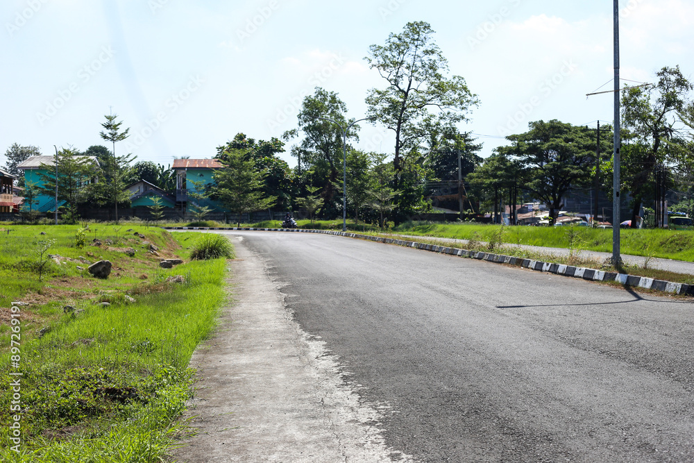 Neat roads and landscapes during the day Neat roads and landscapes during the day