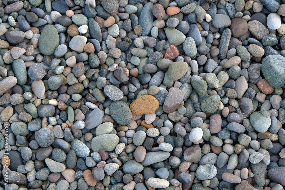 stones background. natural background stones on the beach. multi-colored pebbles with rounded stones as a background stones background. natural background stones on the beach. multi-colored pebbles with rounded stones as a background