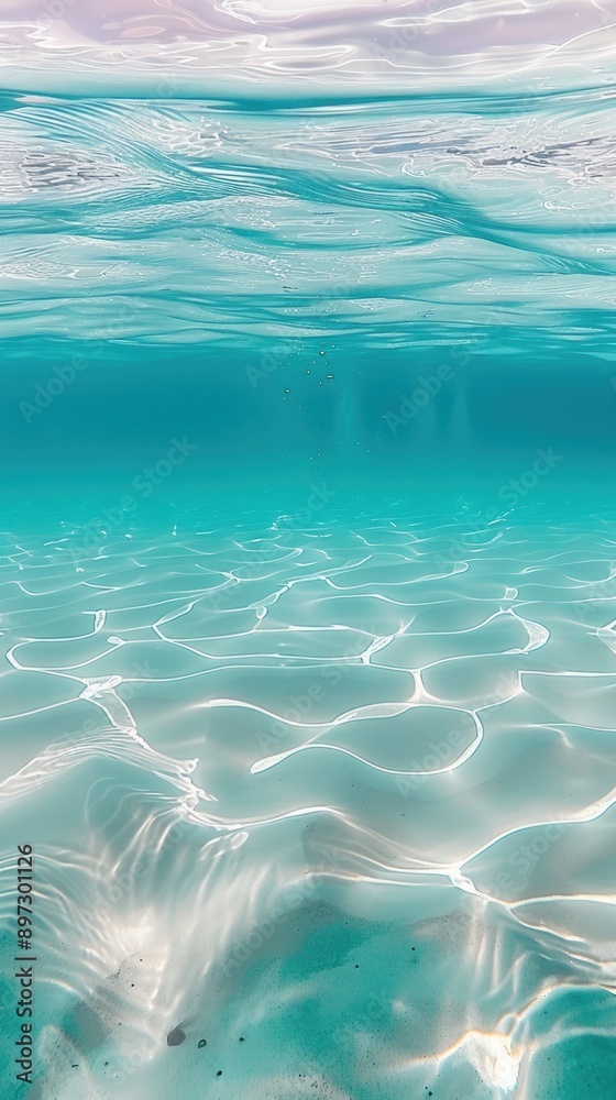 Fototapeta premium Aquamarine sea waves flowing gently over sandy bottom.