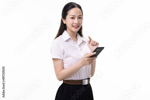 Portrait pretty Asian student girl in Thai university uniform using mobile app on smart phone isolated on white background.