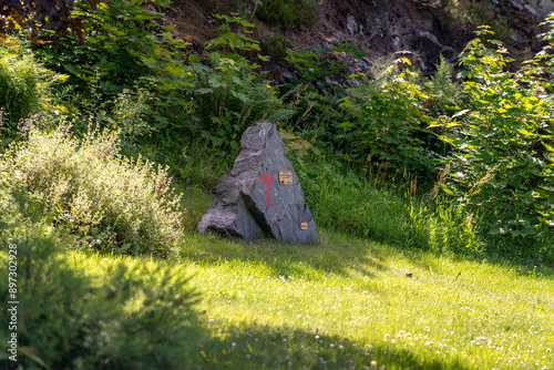 Red sign of DNT on the stone marking the trail of the Romsdalseggen for hikers in Norway in Andalsnes photo