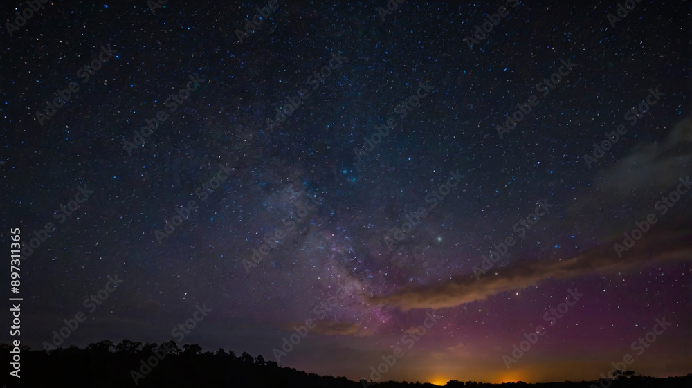 Naklejka premium Night Sky Filled with Vibrant, Colorful Stars