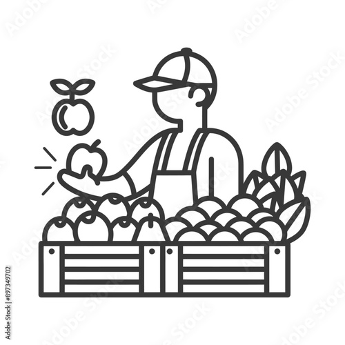 Farmer Holding Apple in Front of Crate of Fruit