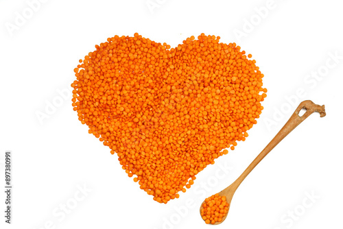 Pile red lentil in shape of heart isolated on white background. Top view. Flat lay. Vegetarian and vegan diet. High content of B vitamins in Red lentils. healthy Superfood