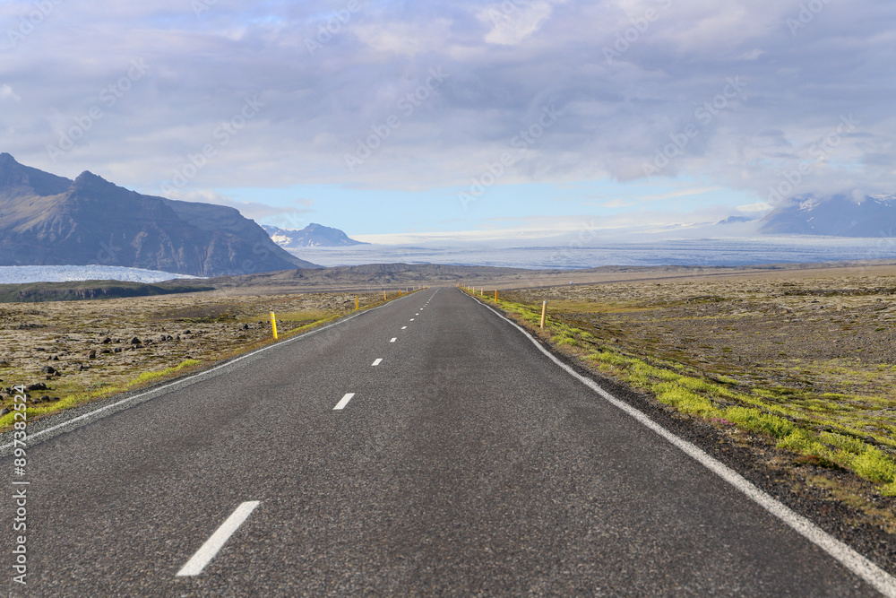 Fototapeta premium Road in the south of Iceland, on a summer day with blue sky