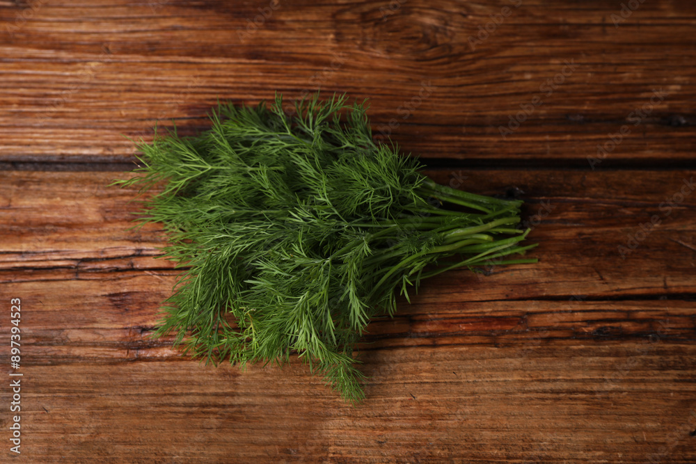 Sprigs of fresh green dill on wooden table, top view Sprigs of fresh green dill on wooden table, top view