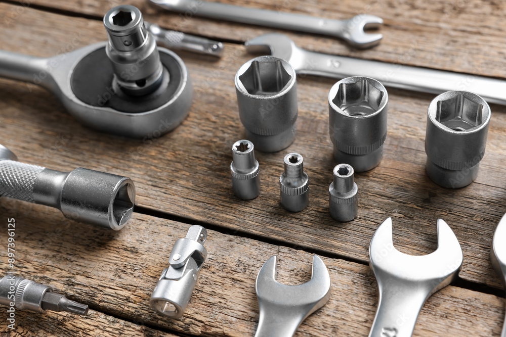 Different auto mechanic's tools on wooden table Different auto mechanic's tools on wooden table