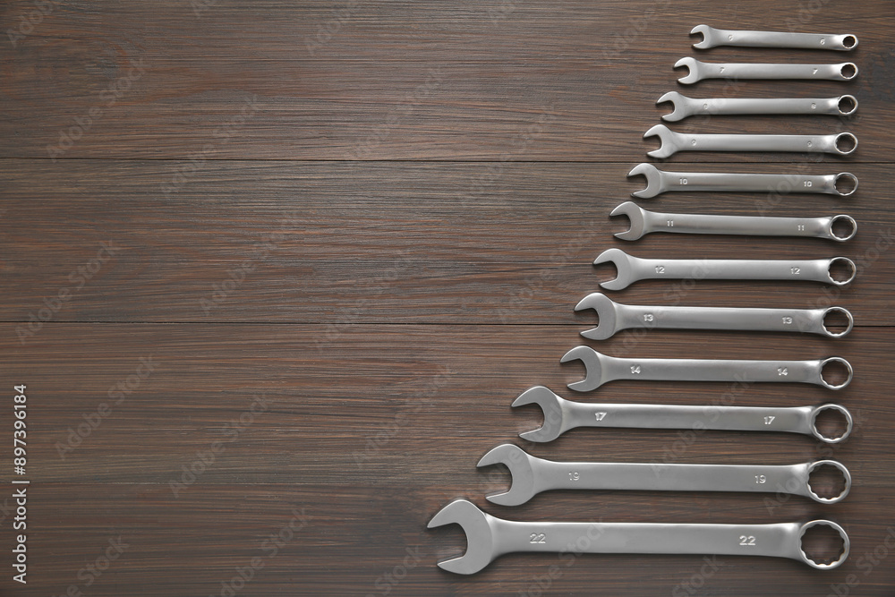 Auto mechanic's tools on wooden table, flat lay. Space for text Auto mechanic's tools on wooden table, flat lay. Space for text