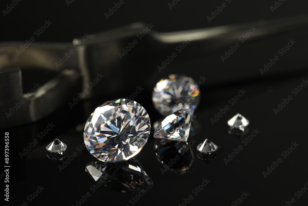 Many beautiful shiny diamonds on black mirror surface, closeup Many beautiful shiny diamonds on black mirror surface, closeup