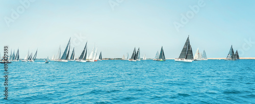 Fotografie Sailboats races in regatta near Brindisi under blue cloudless sky