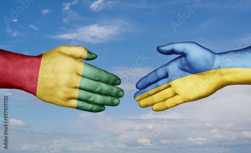 Cuadro en lienzo Ukraine and  Guinea-Conakry country handshaking with flags, consensus concept in