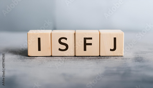 Wooden cubes with text ISFJ. Introversion, Sensing, Feeling, Judging. Personality type. Close-up. photo