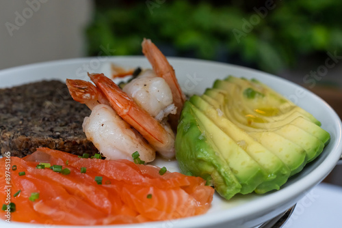 Healthy seafood plate with salmon, shrimp and avocado. Low-carbohydrate breakfast rich in healthy fats. High quality photo photo