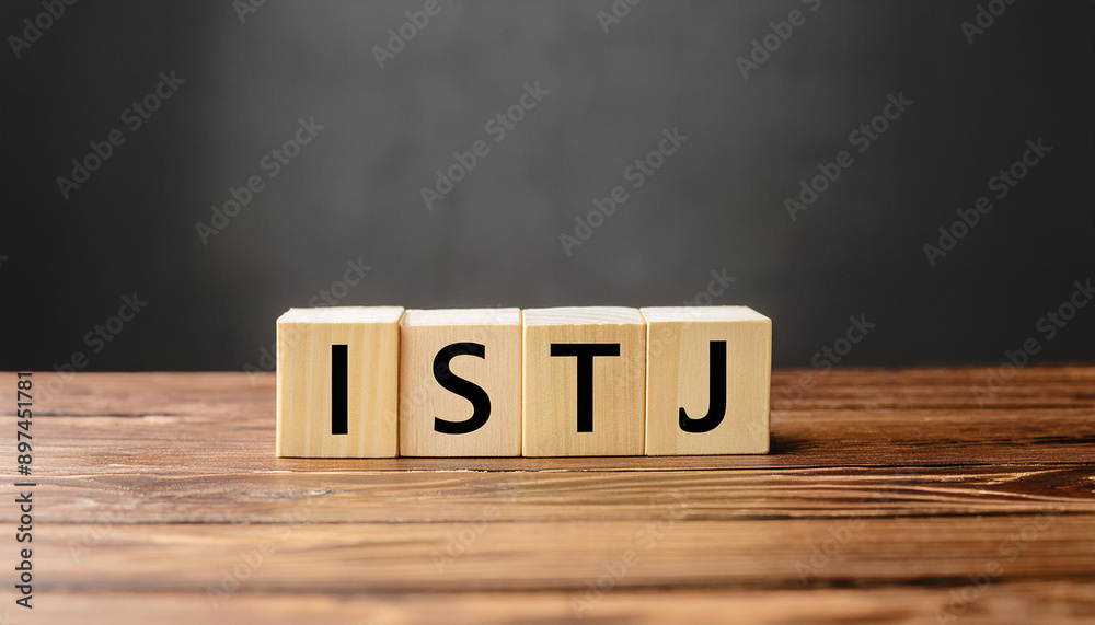 Wooden cubes with text ISTJ. Introversion, Sensing, Thinking, Judging. Personality type. Close-up.