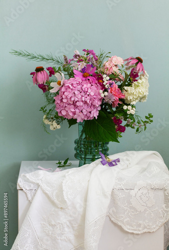 Obraz na płótnie A bouquet of summer flowers in the room. Hydrangea, rose, echinacea, mint, snapdragon, asparagus and other flowers. w salonie