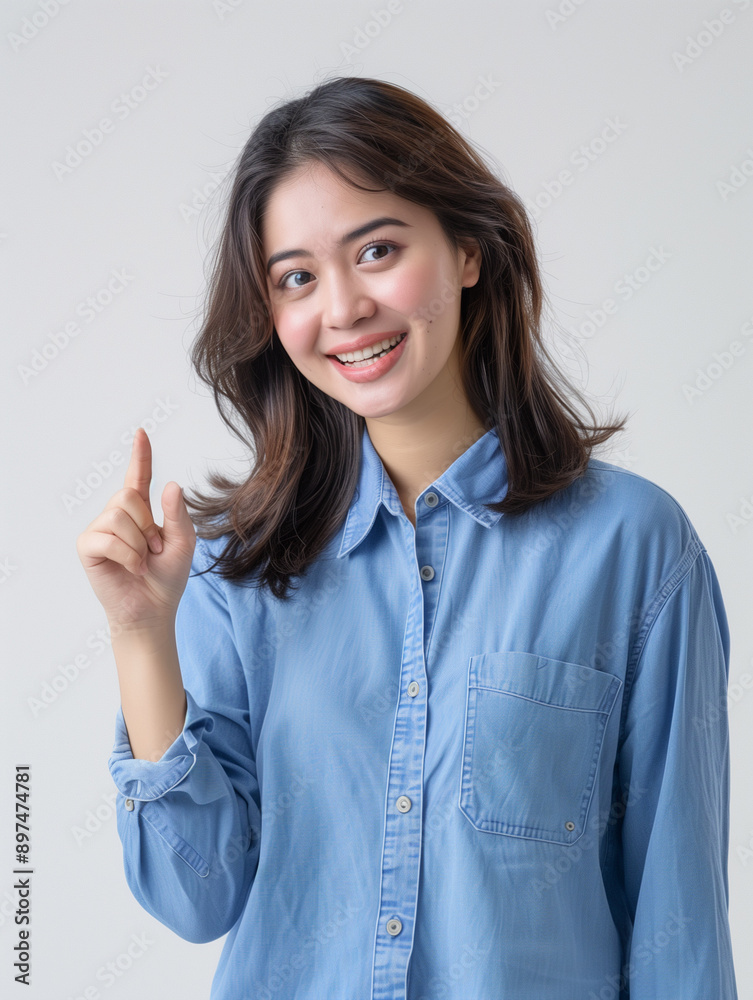 Indonesian adult women looking at camera. pointing to the left or right. asian women advertising photography. enthusiastic. excited. white background Indonesian adult women looking at camera. pointing to the left or right. asian women advertising photography. enthusiastic. excited. white background