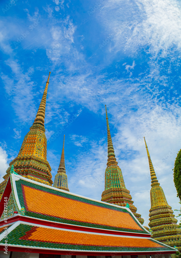 Fototapeta premium Picture of pagodas in Wat Pho in Bangkok, Thailand, one of Thailand's oldest temples.