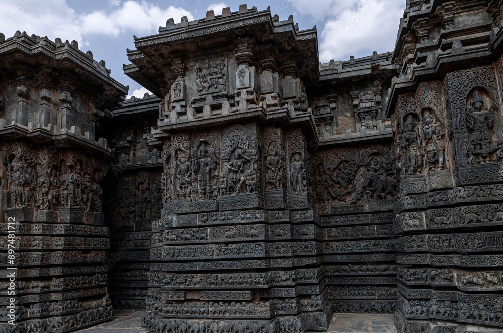 Intricate carvings of Hindu deities and also depict scenes from Hindu epics in the Hindu temple of Halebidu. India. Intricate carvings of Hindu deities and also depict scenes from Hindu epics in the Hindu temple of Halebidu. India.