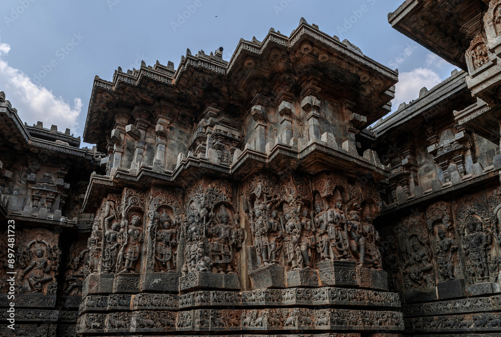 Intricate carvings of Hindu deities and also depict scenes from Hindu epics in the Hindu temple of Halebidu. India. Intricate carvings of Hindu deities and also depict scenes from Hindu epics in the Hindu temple of Halebidu. India.