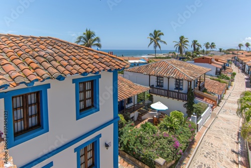 Scenic coastal village with terracotta rooftops and blue accents, capturing the charm and tranquility of Mediterranean architecture.