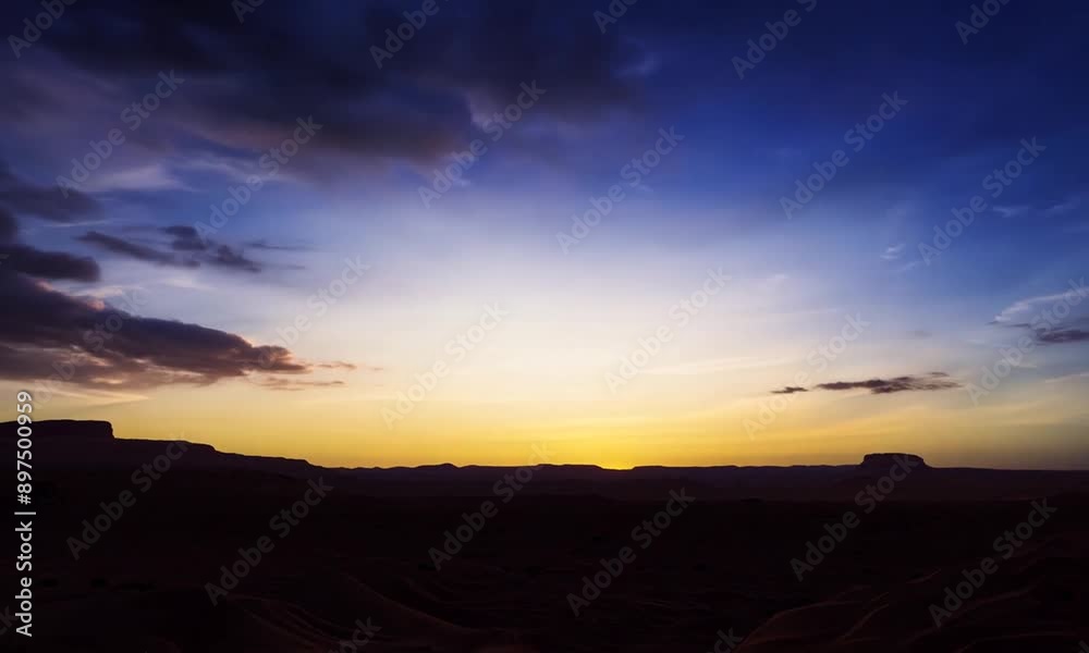 A desert landscape with a sun setting in the background. The sky is filled with clouds, creating a moody atmosphere A desert landscape with a sun setting in the background. The sky is filled with clouds, creating a moody atmosphere