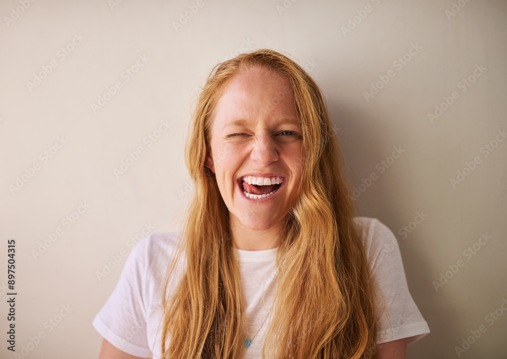 Woman, portrait and tongue on wall background with smile, excited and joyful expression for fun. Female person, face and confident wink for positive attitude, happiness and playful personality