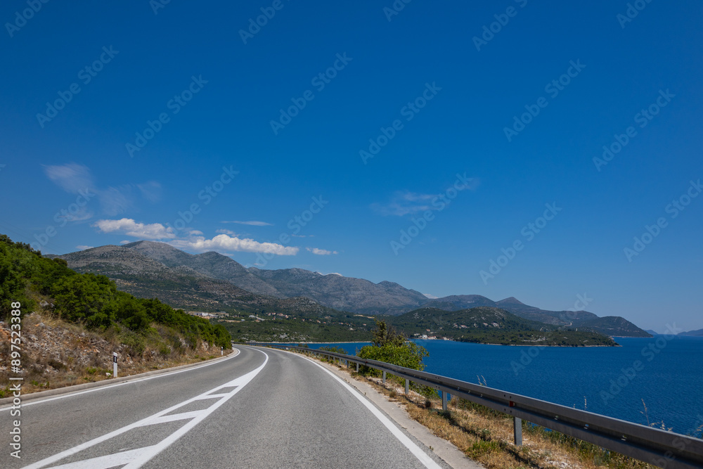 Croatia road. Croatia - Adriatic Highway (Jadranska Magistrala) road along the coast. Croatia. Beautiful nature and landscape. Coastal Road and Sea in Summer Croatia road. Croatia - Adriatic Highway (Jadranska Magistrala) road along the coast. Croatia. Beautiful nature and landscape. Coastal Road and Sea in Summer