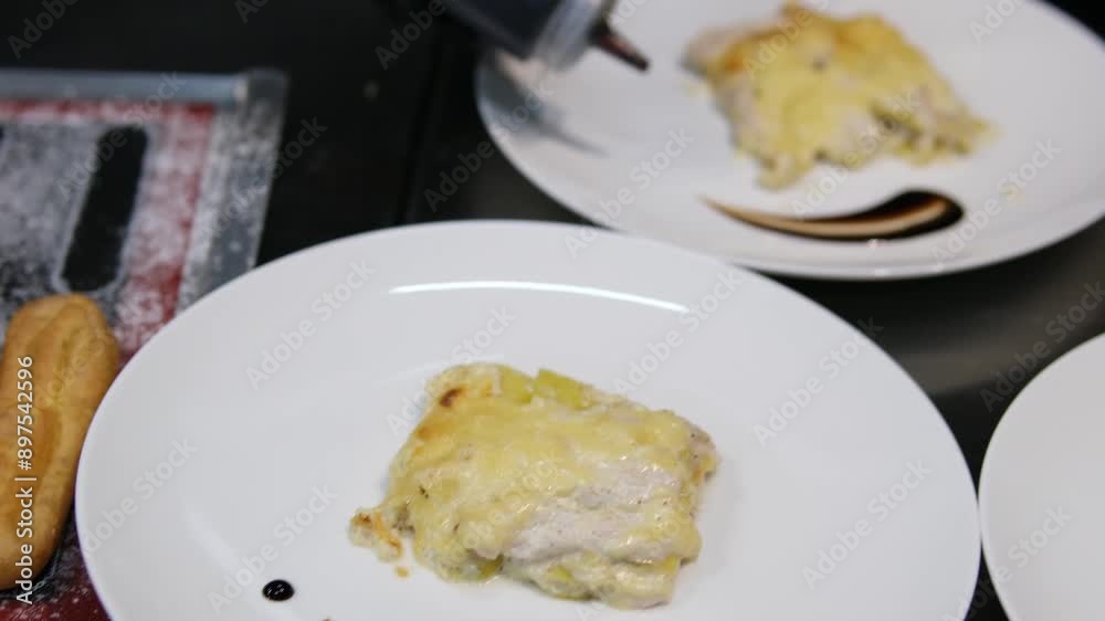 potato gratin with chicken Woman puts chicken meat on a layer of potatoes in a glass dish. Cooking at home. potato gratin with chicken Woman puts chicken meat on a layer of potatoes in a glass dish. Cooking at home.