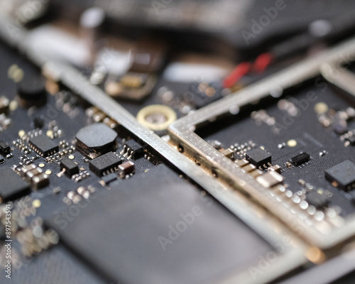 The inside of a laptop laid out on a surface still attached to computer shell photo