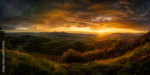 Breathtaking sunset over rolling hills and valleys, showcasing vibrant colors and dramatic skies