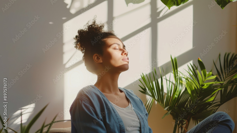 A woman enjoying serene sunlight through a window, sitting comfortably among lush indoor plants in a bright room. A woman enjoying serene sunlight through a window, sitting comfortably among lush indoor plants in a bright room.