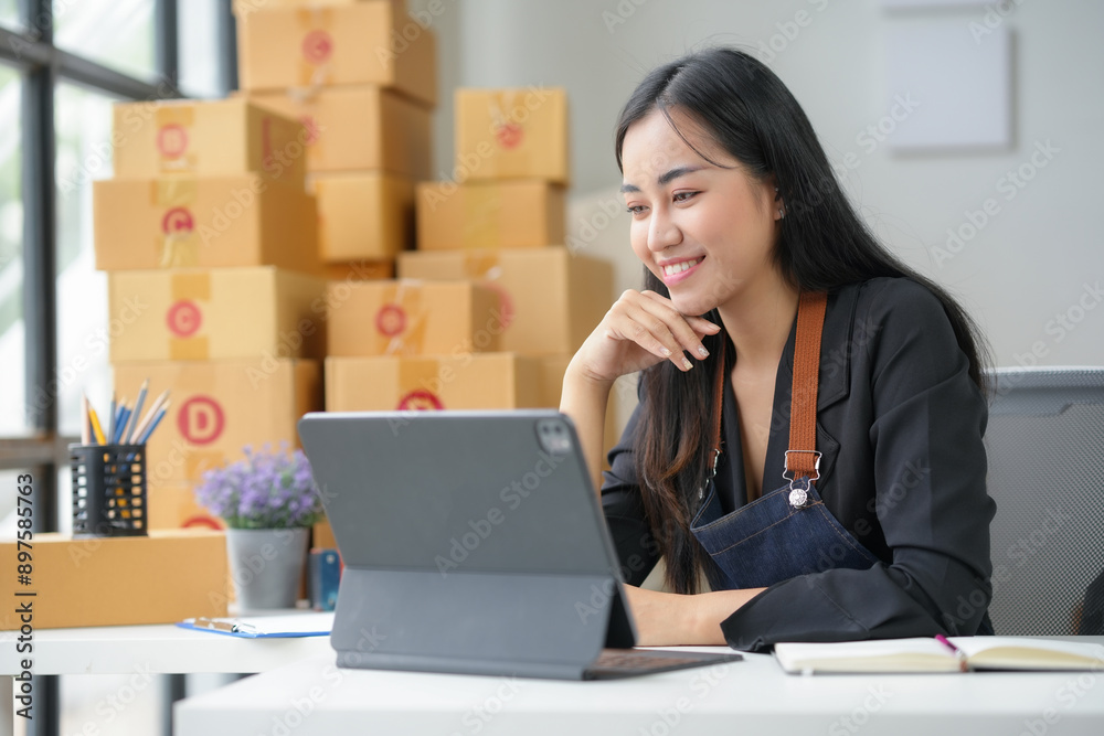 Confident asian woman managing her online business from home. Overseeing e commerce operations on tablet. Ensuring efficient shipping and delivery Confident asian woman managing her online business from home. Overseeing e commerce operations on tablet. Ensuring efficient shipping and delivery