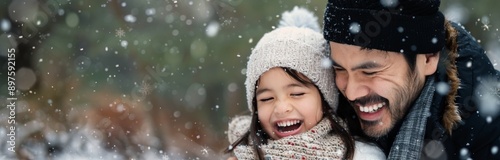 Father and Daughter Laughing in the Snow