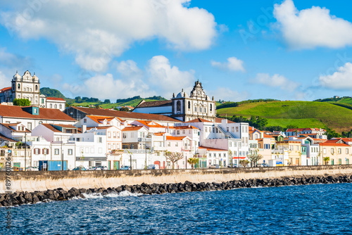 View of Horta port with town buildings and coastal promenade, Faial island, Azores, Portugal
