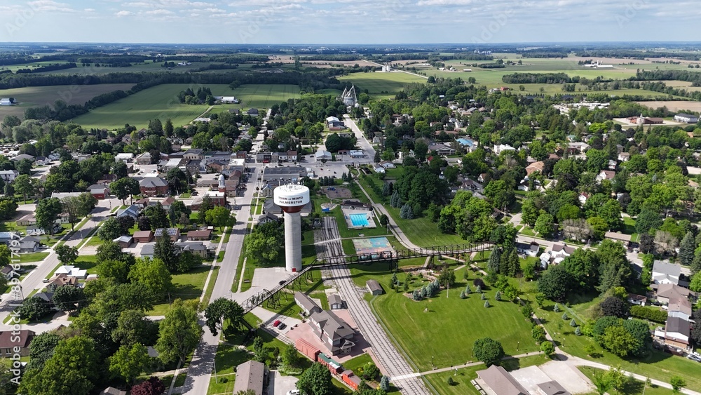 Fototapeta premium Aerial of Palmerston water tower in the Town of Minto, with residential areas and green surroundings