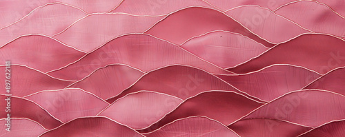 A rich pink background featuring a pattern of overlapping waves, adding movement and interest to the design. photo