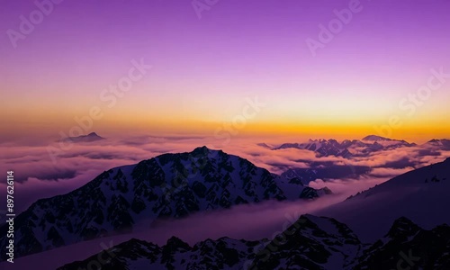 Colorful golden sunset in snowy mountains in winter above mist clouds. Dolly shot time lapse day to night. 4K video Dynamic motion, dynamic blur, 30x speed, unsharp edges. photo