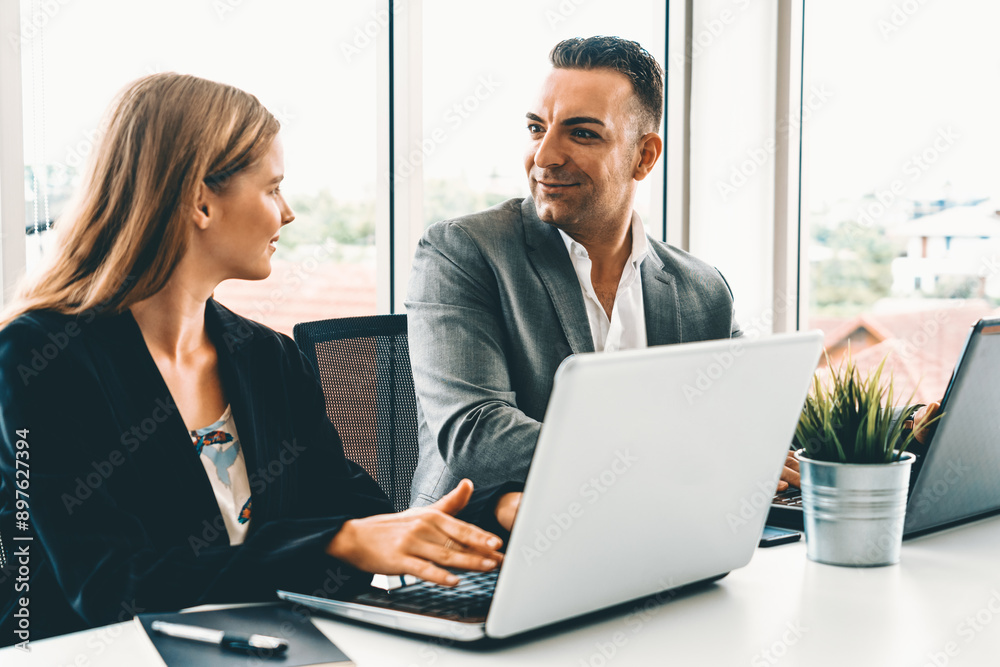 Obraz premium Businessman executive is in meeting discussion with a businesswoman worker in modern workplace office. People corporate business team concept. uds