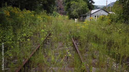Houses and streets in the abandoned coal mining town with a railroad through the middle of it in southern West Virginia.