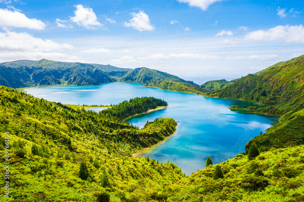 Naklejka premium View of Lagoa do Fogo crater lake in green mountain landscape during summer from famous viewpoint, Sao Miguel island, Azores, Portugal